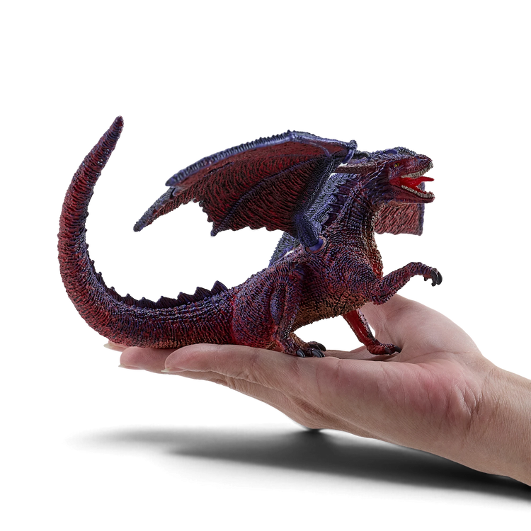 Mojo Fun hand-painted dragon figure with articulated wings, featuring detailed red and purple scales on a palm.